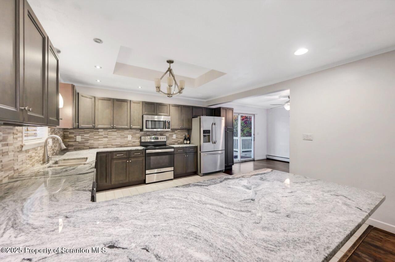 1427 Birch Street Scranton, PA 18505 - Photo 16 of 55 a large kitchen with stainless steel appliances granite countertop a sink stove and refrigerator