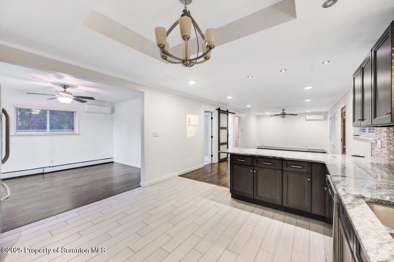 1427 Birch Street Scranton, PA 18505 - Photo 17 of 55 a large kitchen with stainless steel appliances granite countertop a sink and cabinets