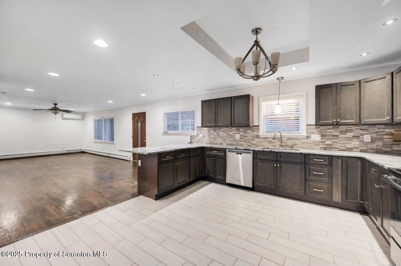 1427 Birch Street Scranton, PA 18505 - Photo 19 of 55 a large kitchen with stainless steel appliances kitchen island granite countertop a stove and a sink with granite countertops