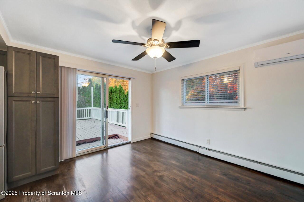 1427 Birch Street Scranton, PA 18505 - Photo 21 of 55 a view of an empty room with wooden floor and a window