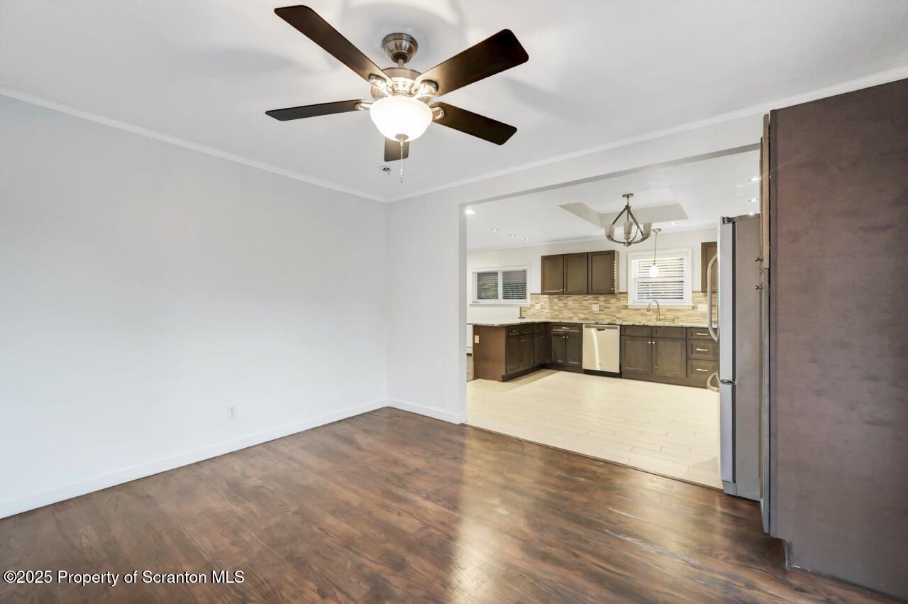 1427 Birch Street Scranton, PA 18505 - Photo 23 of 55 a large white kitchen with a large window a sink and stainless steel appliances