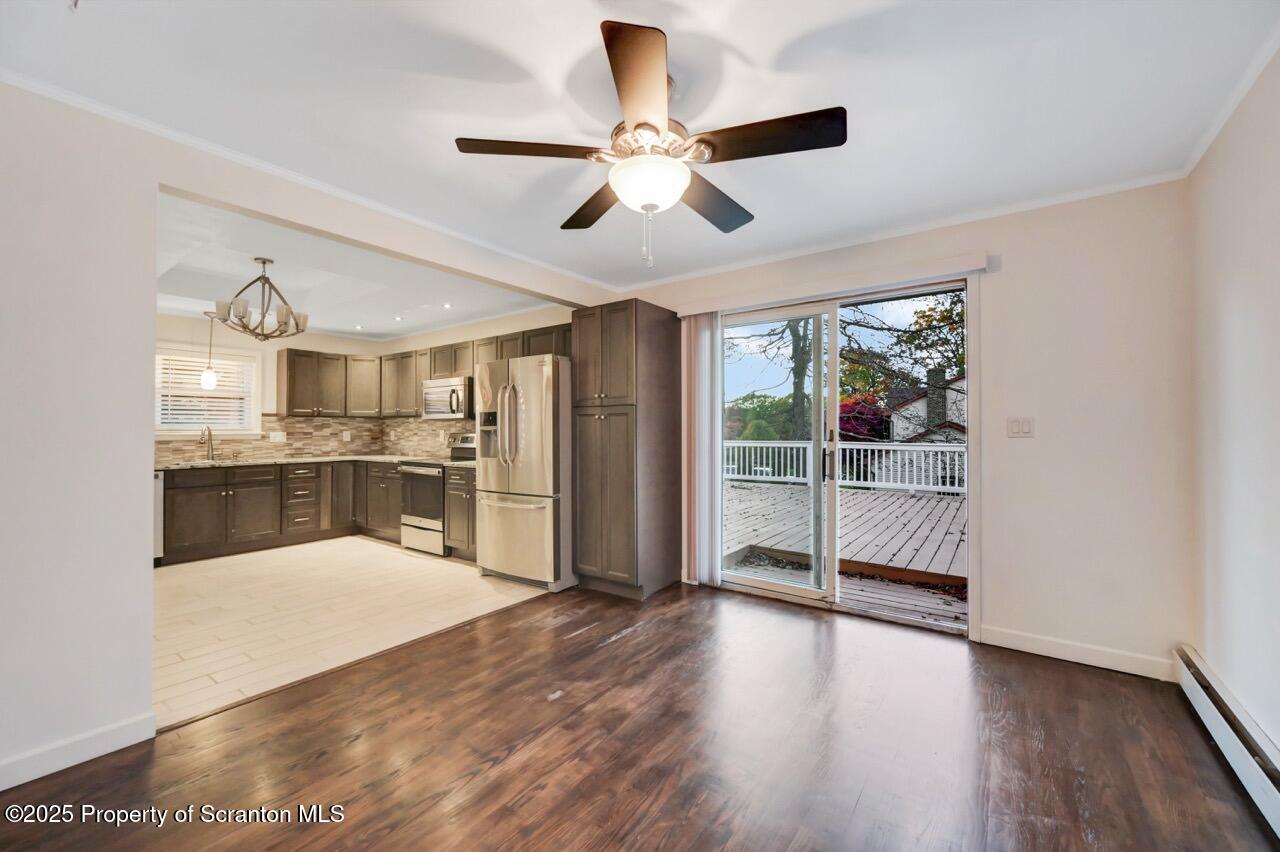 1427 Birch Street Scranton, PA 18505 - Photo 24 of 55 a view of a kitchen with wooden floor and a ceiling fan