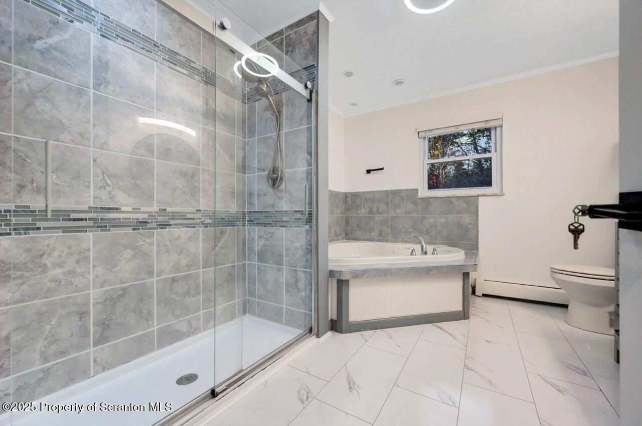 1427 Birch Street Scranton, PA 18505 - Photo 27 of 55 a bathroom with a bathtub and a shower