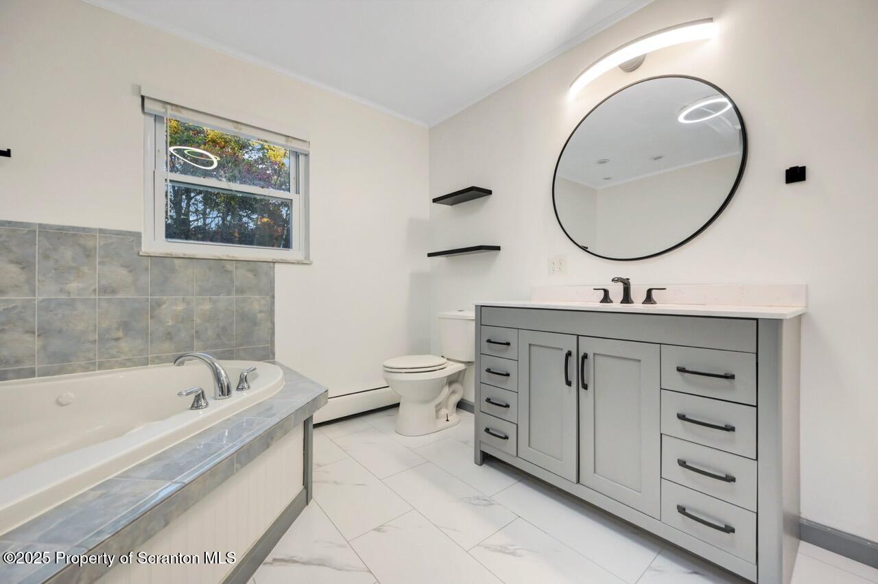 1427 Birch Street Scranton, PA 18505 - Photo 28 of 55 a bathroom with a bathtub sink mirror and vanity