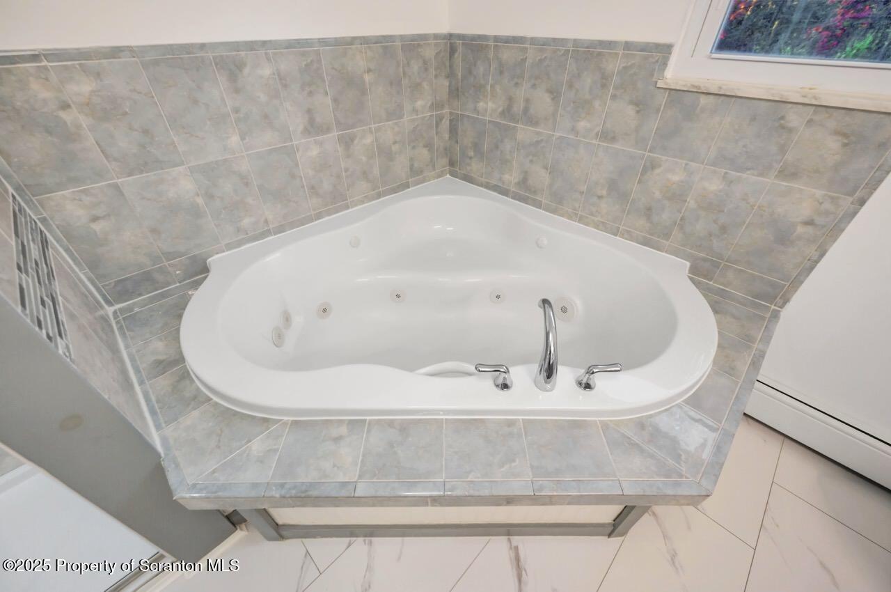 1427 Birch Street Scranton, PA 18505 - Photo 31 of 55 a close view of a bathtub in bathroom