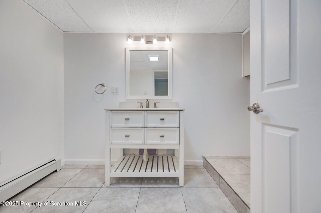 1427 Birch Street Scranton, PA 18505 - Photo 36 of 55 a bathroom with a sink a mirror and a vanity