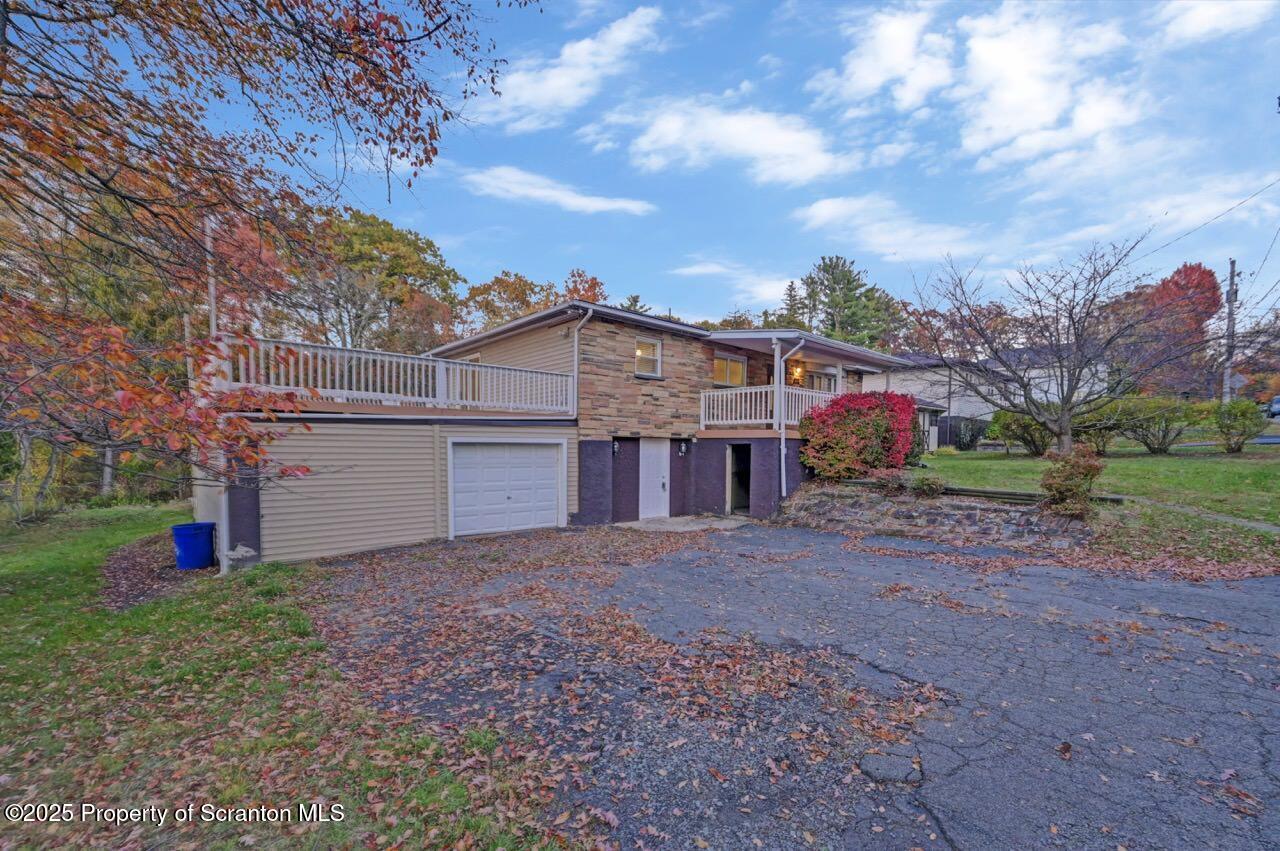 1427 Birch Street Scranton, PA 18505 - Photo 55 of 55 a view of a house with a yard and large tree