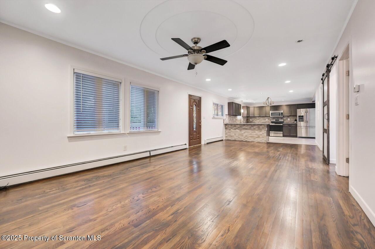1427 Birch Street Scranton, PA 18505 - Photo 8 of 55 a view of a living room and a wooden floor