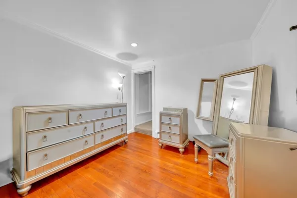 a room with furniture and mirror