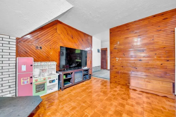 a view of a living room with a flat screen tv