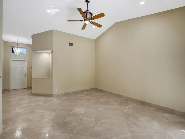 a bathroom with a sink a toilet a mirror and shower