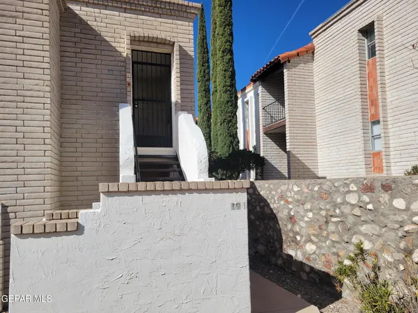 a view of a windows and entrance to house