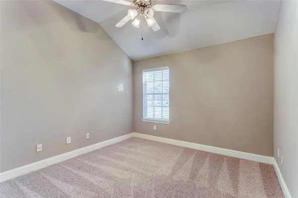 an empty room with a empty space and windows