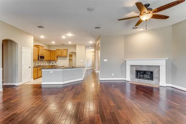 a view of a kitchen with a sink and a fireplace