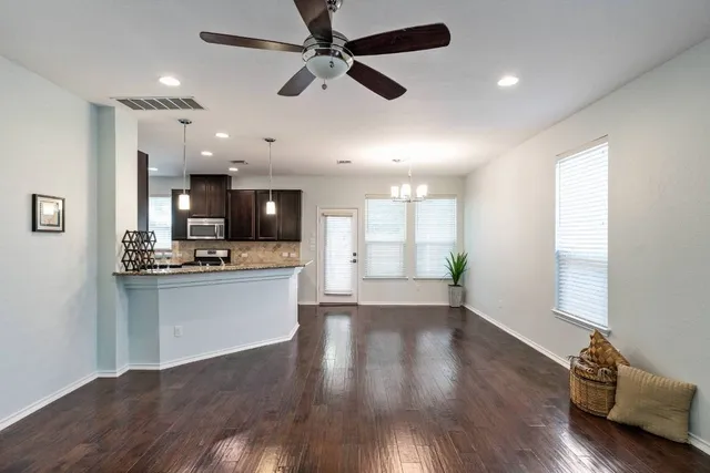 a view of kitchen with sink microwave and stove