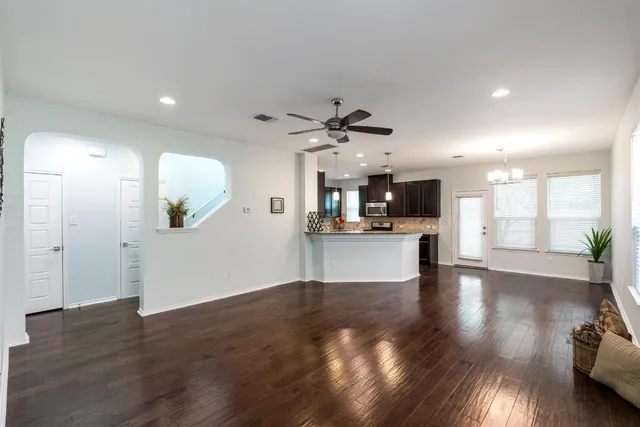 a view of kitchen with cabinets and wooden floor