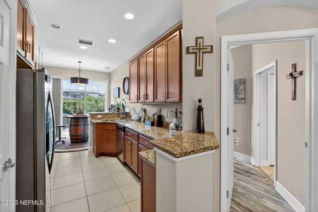 a view of a workspace with furniture and a fireplace