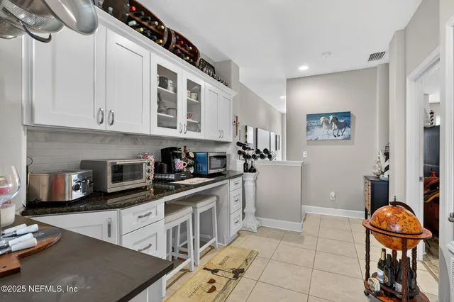 a view of a house with sitting area and garden