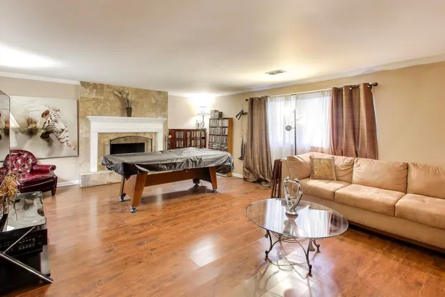 a living room with furniture and a fireplace