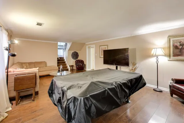 a bed room with a bed and a television