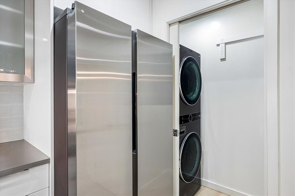12680 Hillcrest Road, Unit 1109 Dallas, TX 75230 - Photo 10 of 22 Laundry room is off of the kitchen. LG stack washer dryer conveys.