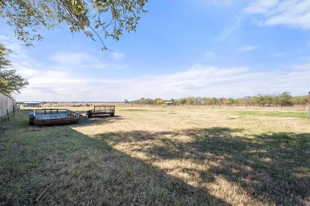 a view of a lake with houses in the back