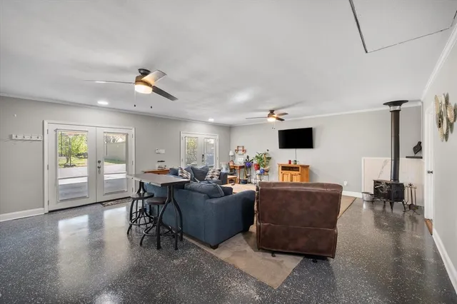 a living room with furniture and flat screen tv