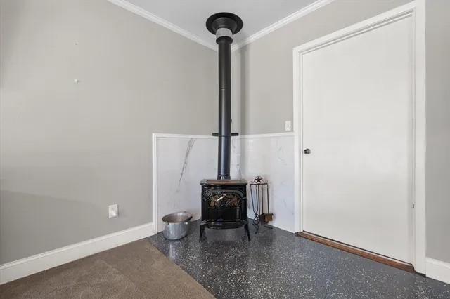 a view of hallway with table and a chair