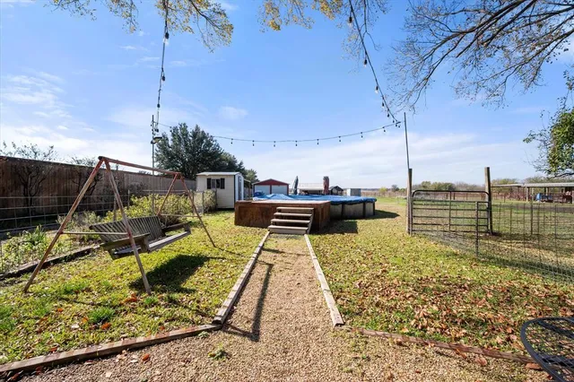 a view of a swimming pool with a patio