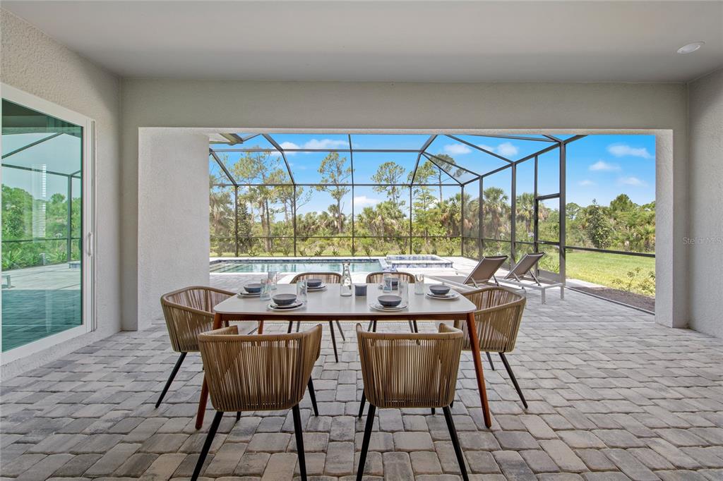 7161 Inlet Isles Lakewood Ranch, FL 34202 - Photo 23 of 29 a dining room with furniture and window