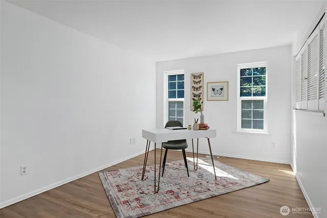 a work room with furniture and windows