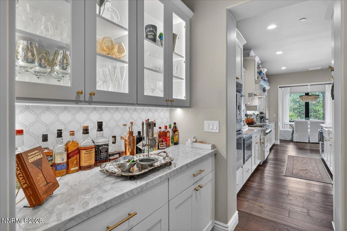 5096 Bordeaux Court Reno, NV 89511 - Photo 28 of 70 a kitchen with granite countertop lots of counter top space and wooden floor