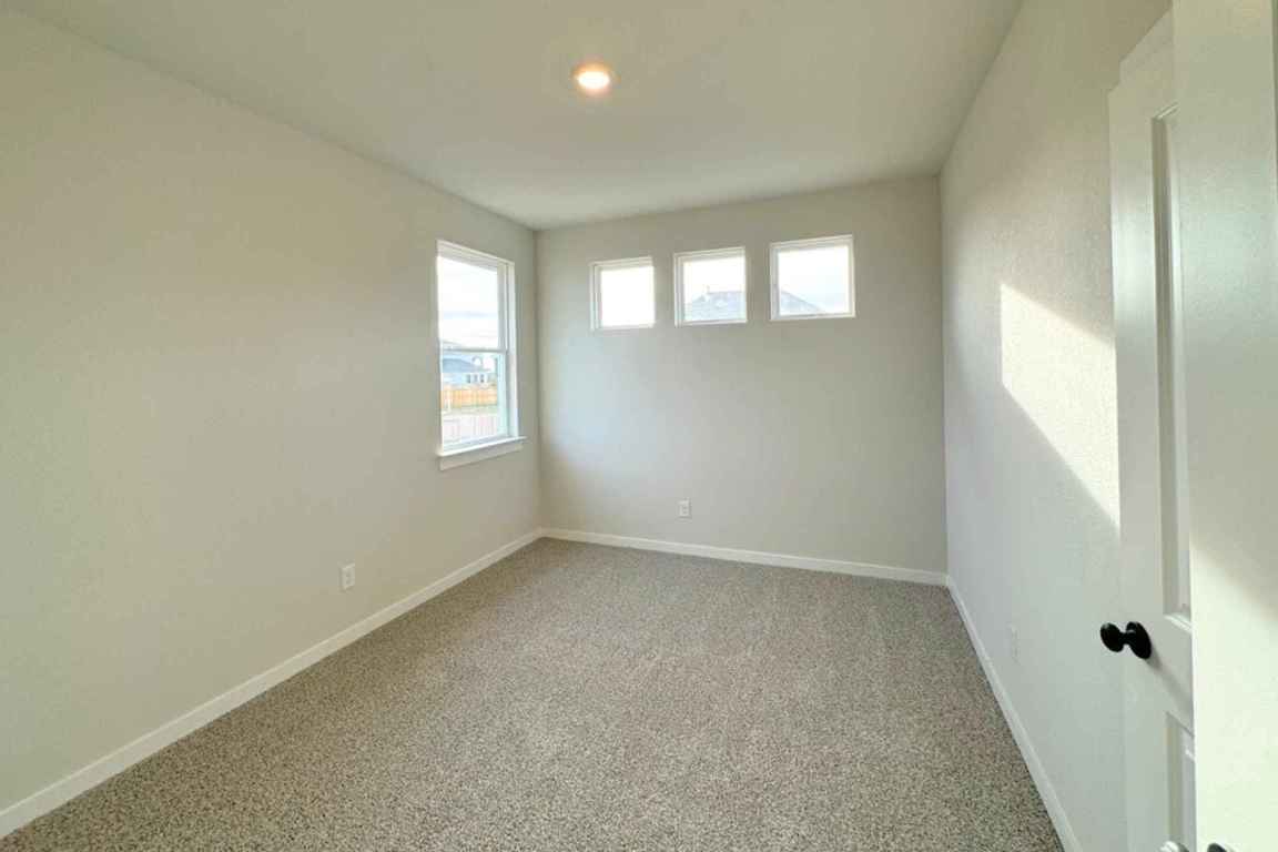 237 Wingstem Way Georgetown, TX 78633 - Photo 11 of 40 an empty room with windows