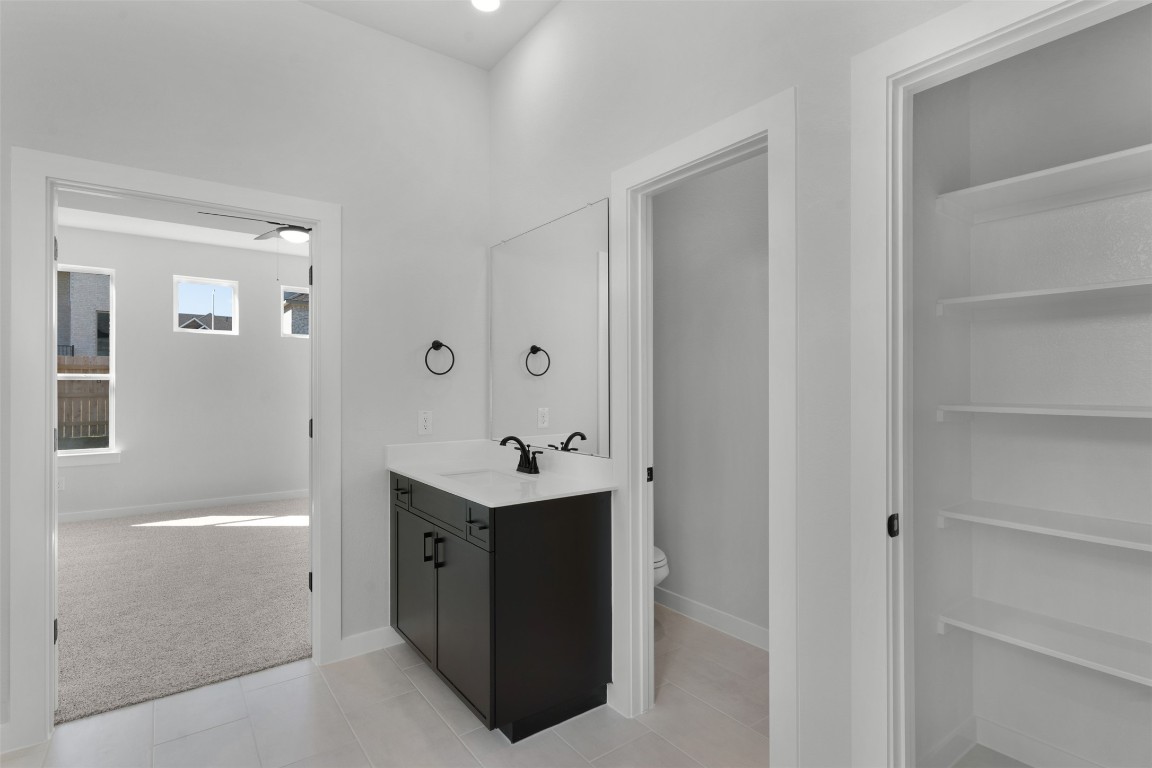 237 Wingstem Way Georgetown, TX 78633 - Photo 13 of 26 Bathroom featuring light carpet and vanity