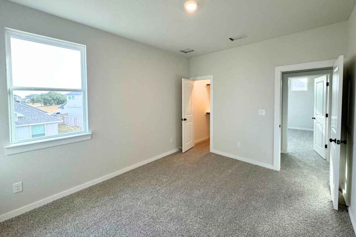 237 Wingstem Way Georgetown, TX 78633 - Photo 13 of 40 an empty room with a window