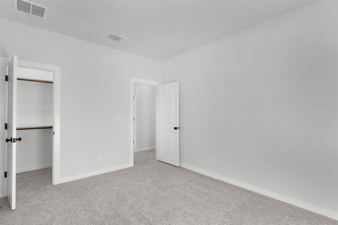 237 Wingstem Way Georgetown, TX 78633 - Photo 16 of 26 Unfurnished bedroom with carpet flooring and a walk in closet