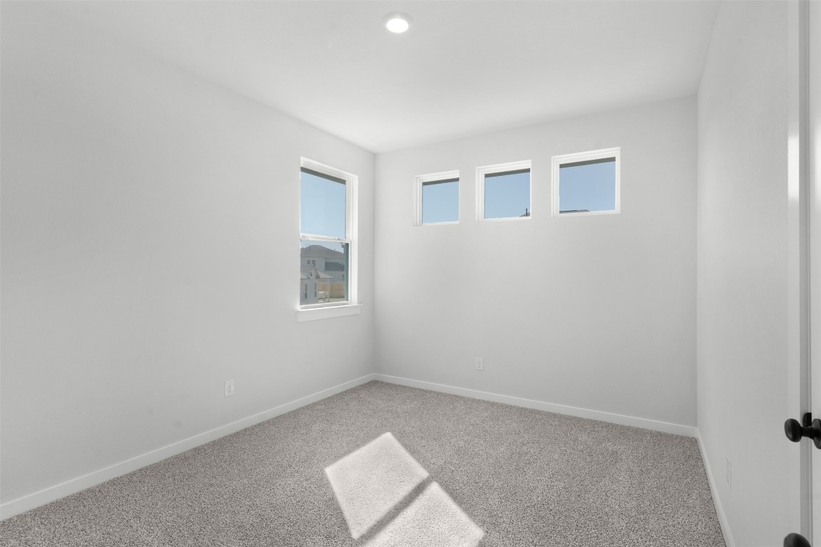 237 Wingstem Way Georgetown, TX 78633 - Photo 17 of 26 Carpeted spare room featuring baseboards