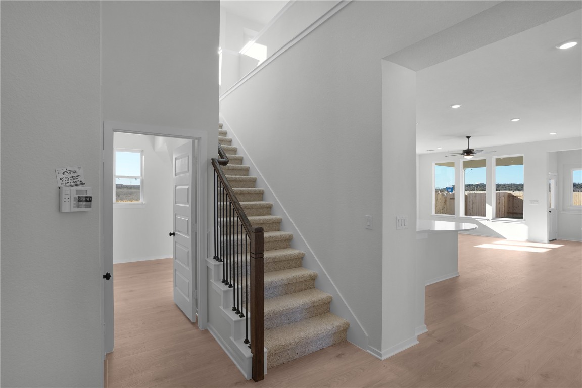 237 Wingstem Way Georgetown, TX 78633 - Photo 24 of 40 a view of a hallway with wooden floor and entryway