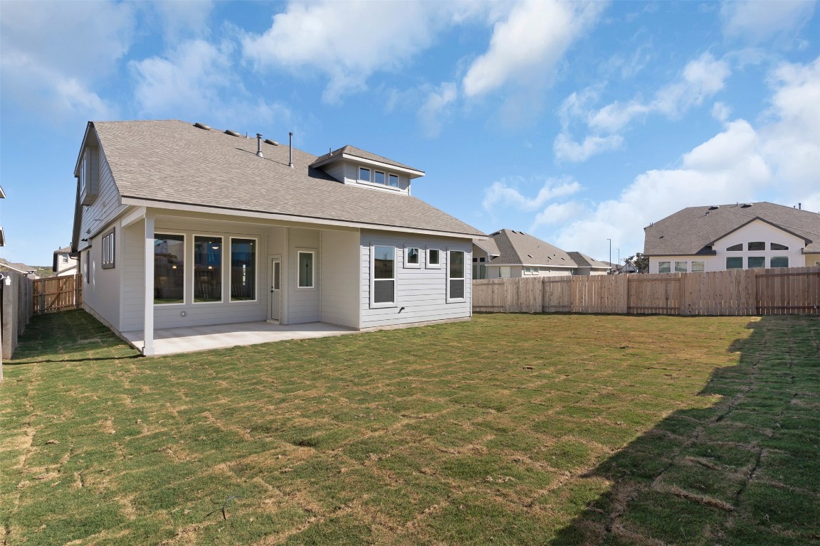 237 Wingstem Way Georgetown, TX 78633 - Photo 19 of 26 Back of house with a patio area, a fenced backyard, and a shingled roof