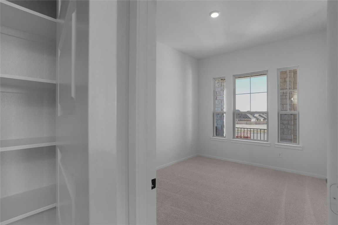 237 Wingstem Way Georgetown, TX 78633 - Photo 25 of 40 a view of an empty room with a window