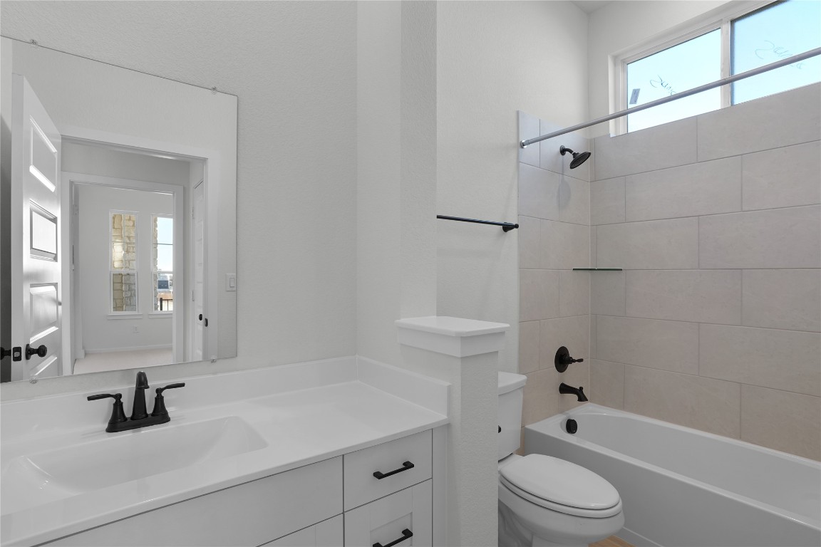 237 Wingstem Way Georgetown, TX 78633 - Photo 26 of 40 a bathroom with a sink a toilet and shower