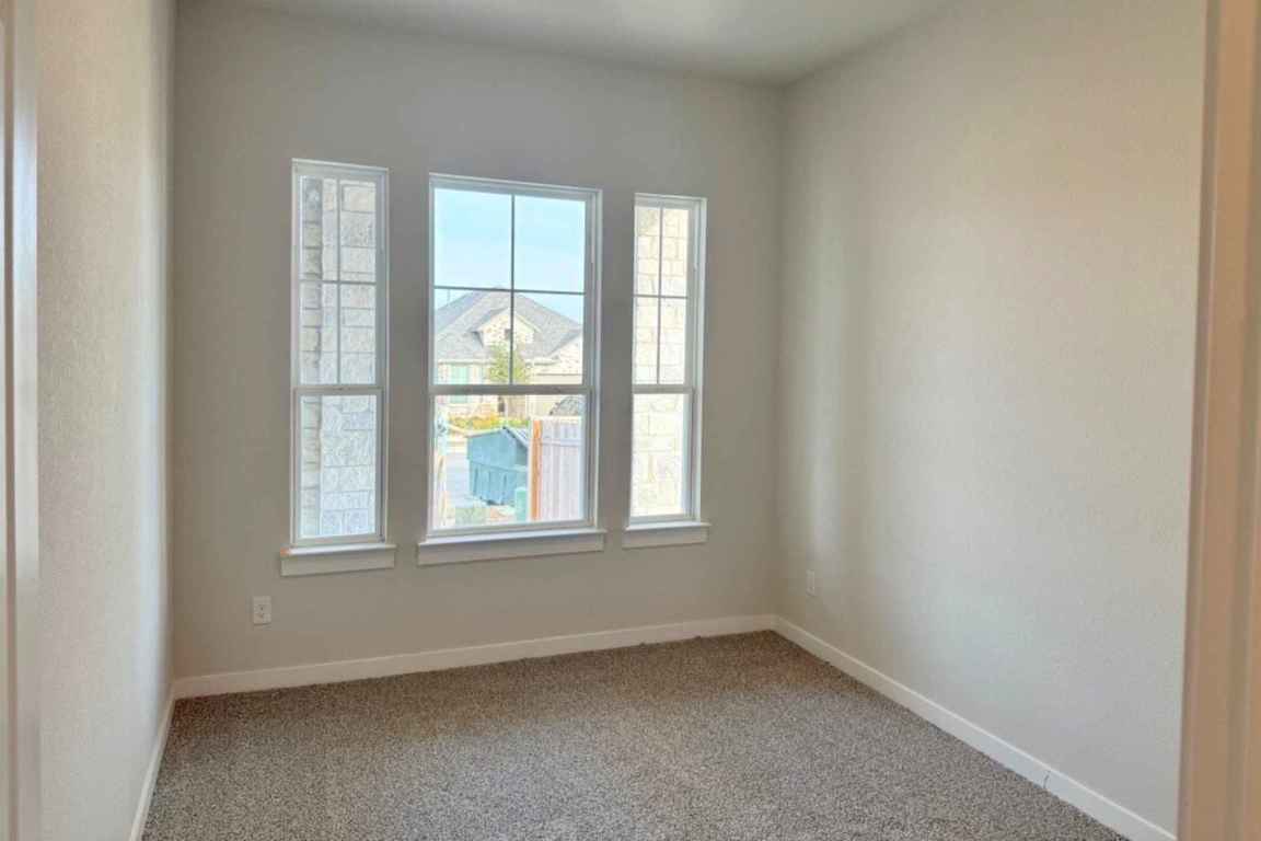237 Wingstem Way Georgetown, TX 78633 - Photo 2 of 40 an empty room with a window