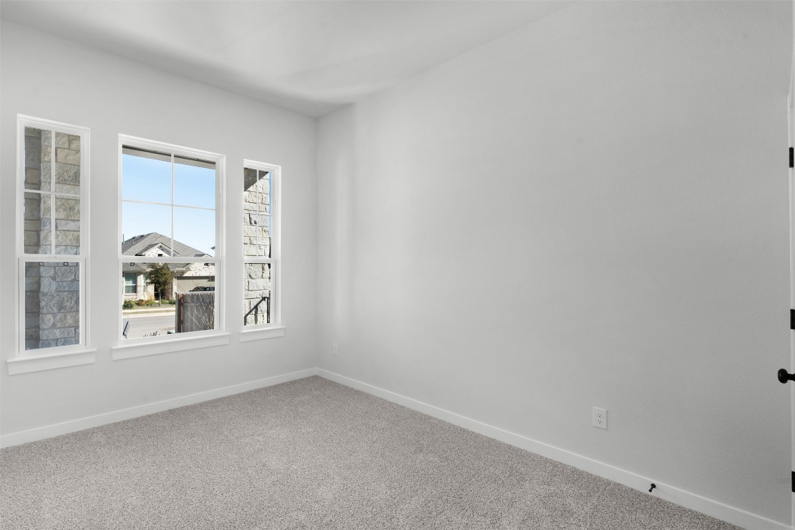 237 Wingstem Way Georgetown, TX 78633 - Photo 4 of 26 Empty room with carpet flooring