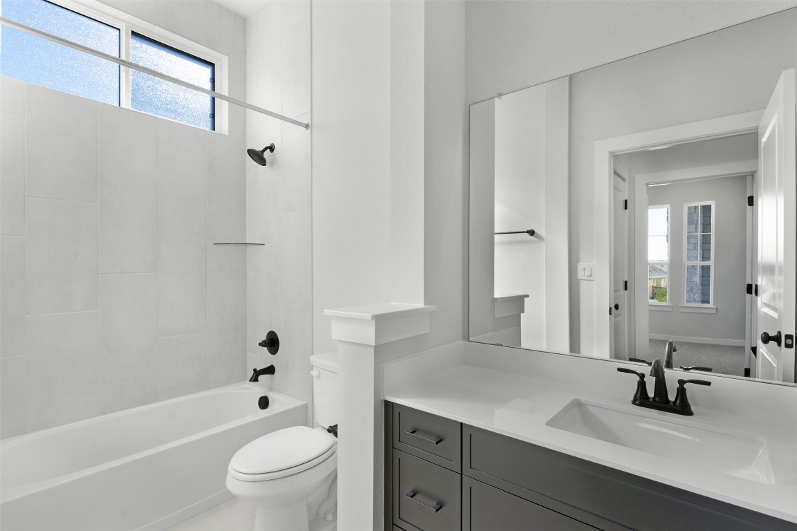 237 Wingstem Way Georgetown, TX 78633 - Photo 5 of 26 Full bath with healthy amount of natural light, washtub / shower combination, and vanity