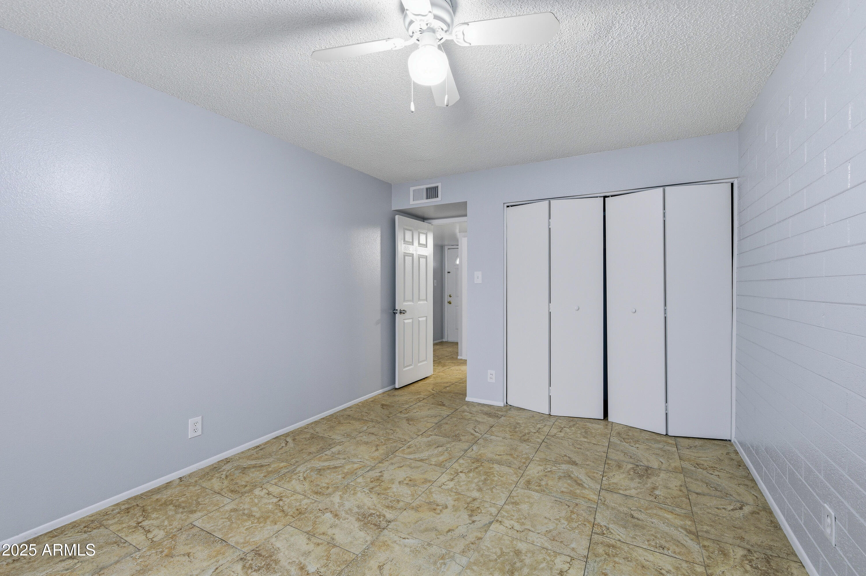 4808 North 71st Lane Phoenix, AZ 85033 - Photo 13 of 20 a view of an empty room