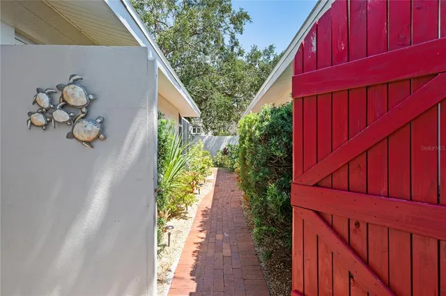a view of a lake with couches in the patio and a yard