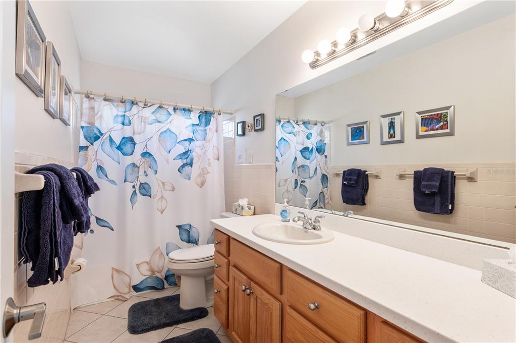 6005 Midnight Pass Road, Unit S4 Sarasota, FL 34242 - Photo 22 of 34 a bathroom with a sink and a mirror