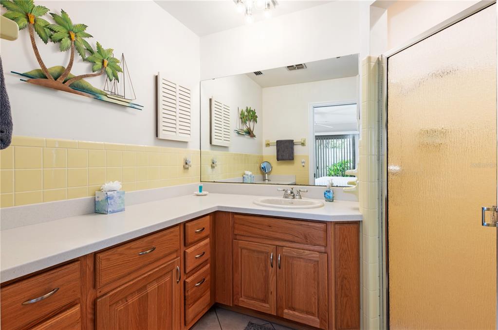 6005 Midnight Pass Road, Unit S4 Sarasota, FL 34242 - Photo 23 of 34 a bathroom with a sink and a mirror