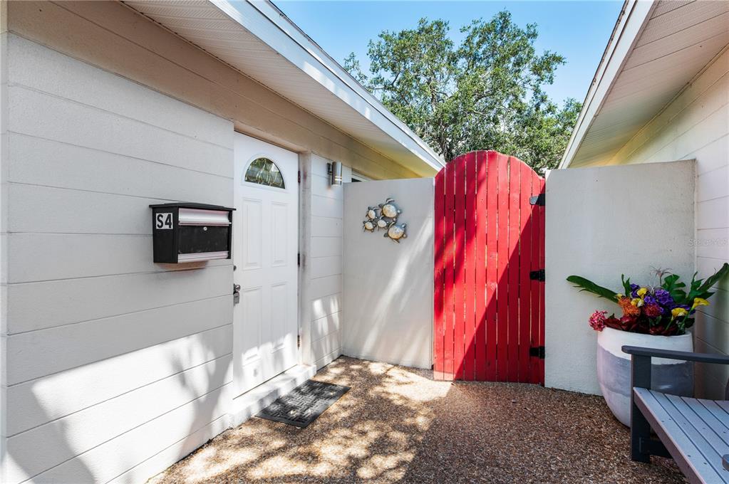 6005 Midnight Pass Road, Unit S4 Sarasota, FL 34242 - Photo 27 of 34 a view of a house with backyard and sitting area