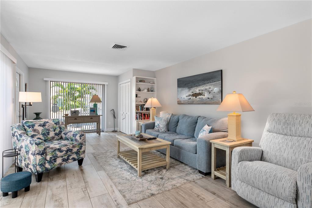 6005 Midnight Pass Road, Unit S4 Sarasota, FL 34242 - Photo 7 of 34 a living room with furniture and a window